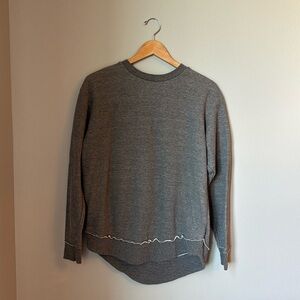 Women’s size medium gray sweatshirt longer in back excellent condition very soft